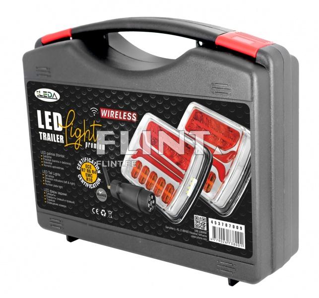 Wireless LED trailer lights packaged in a black case with red accents. The product features technical information and certification symbols on the sides.