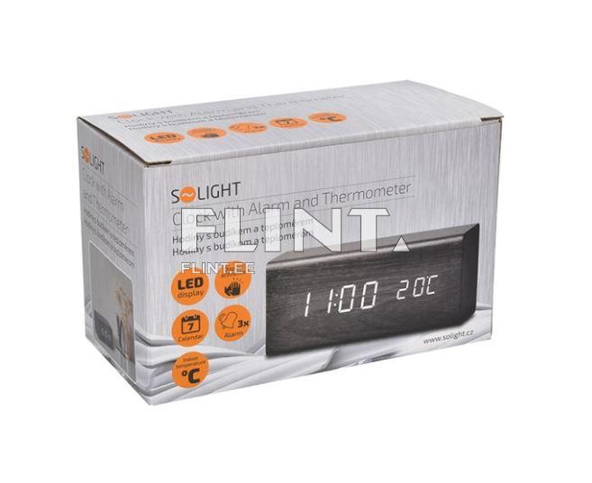 A box containing a clock with an alarm and thermometer. The front features an LED display showing the time as 11:00 and the temperature as 20°C. The box includes icons representing features like a calendar and alarm.