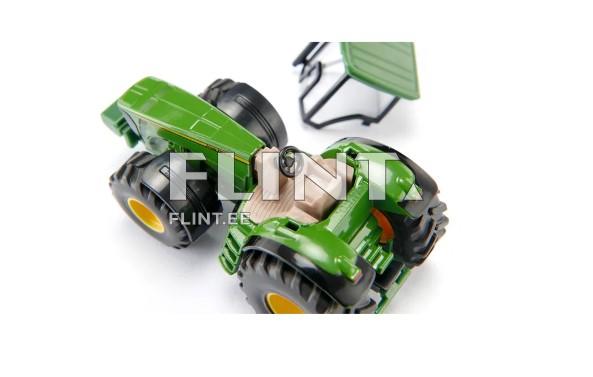 A green tractor model with black tires and yellow rims. The cockpit is light-colored and located in the center, featuring a steering wheel. At the rear, there is an angled cover that is not fully attached.